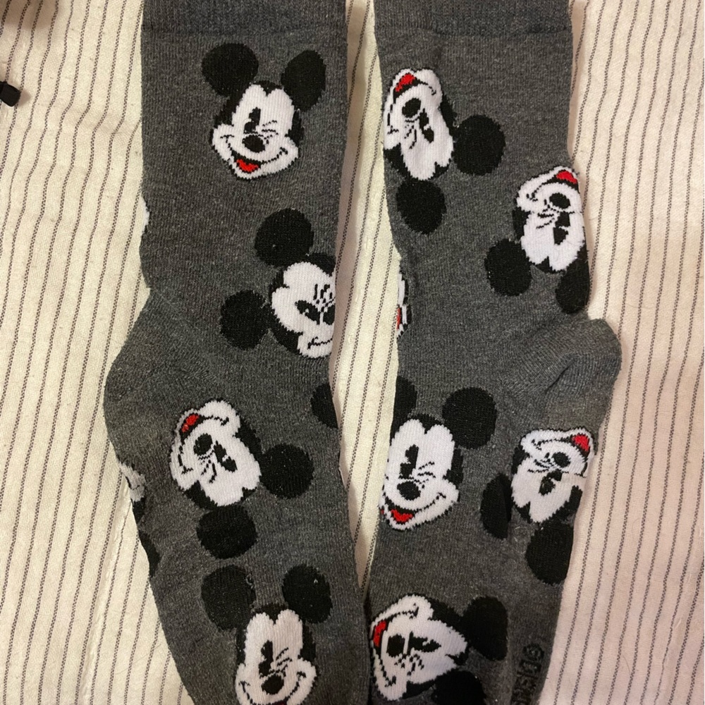 Four pairs of Disney socks… ankle and crew socks… Fits most